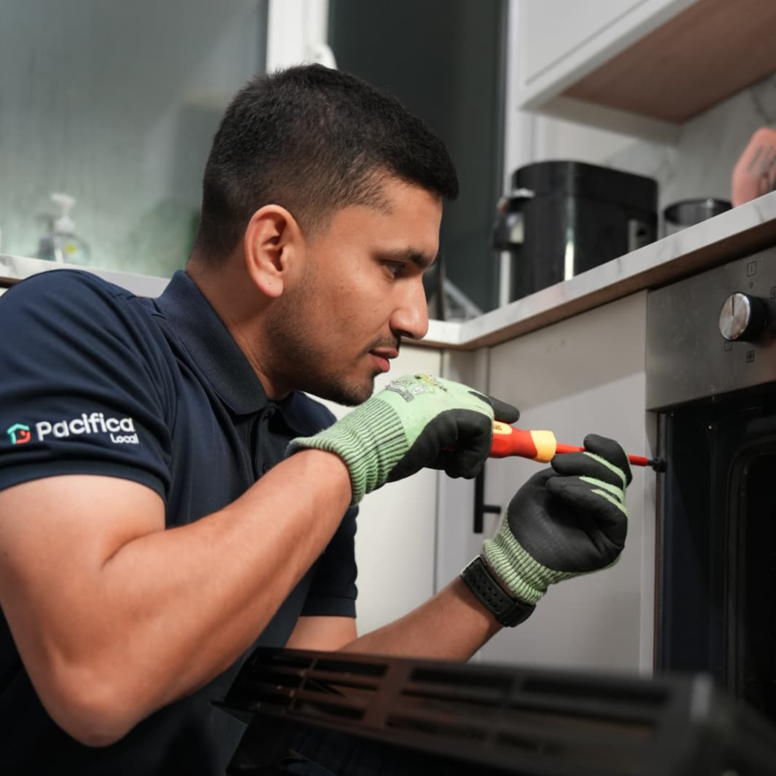 Fixaki electrician repairing a kitchen appliance in the Midlands